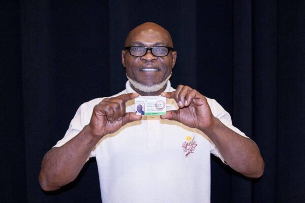 Newcomer Receives a FaithAction ID Card in Greensboro, NC.